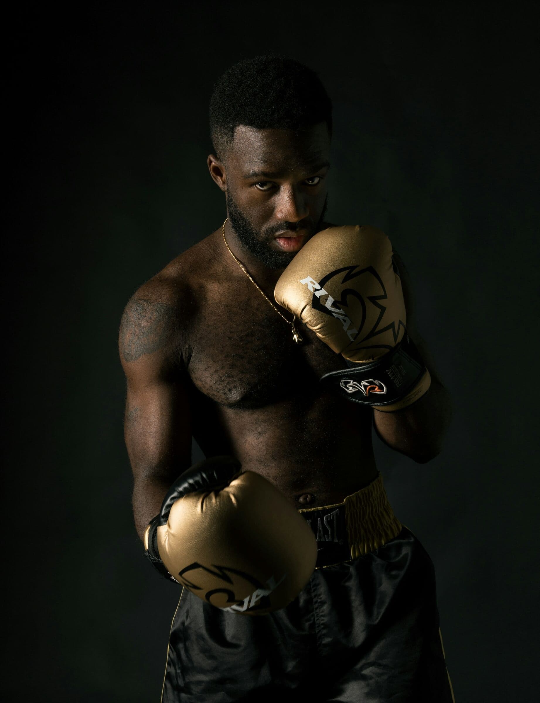 A boxer in his guard, waiting for the call
