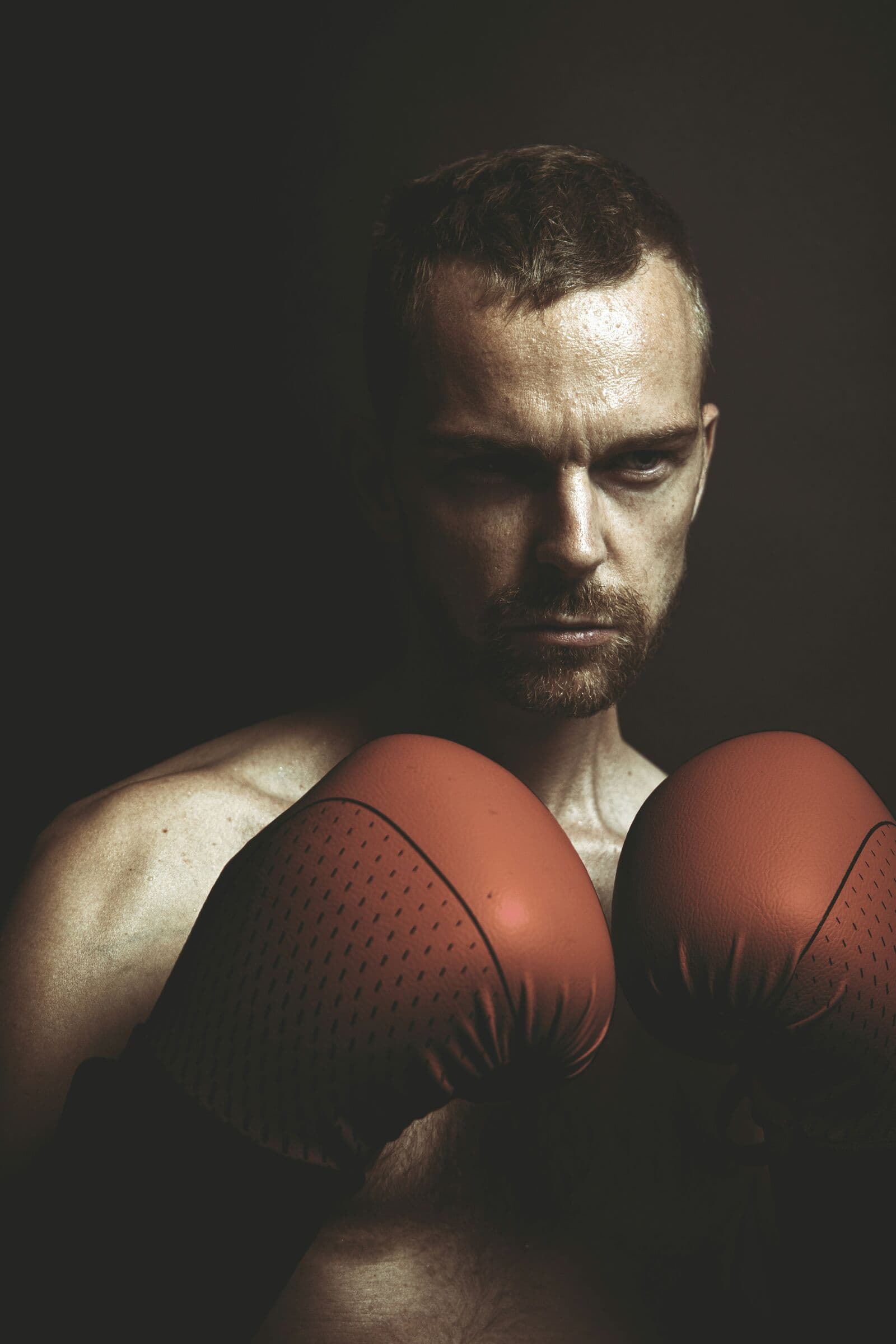 A boxer with his gloves up, ready